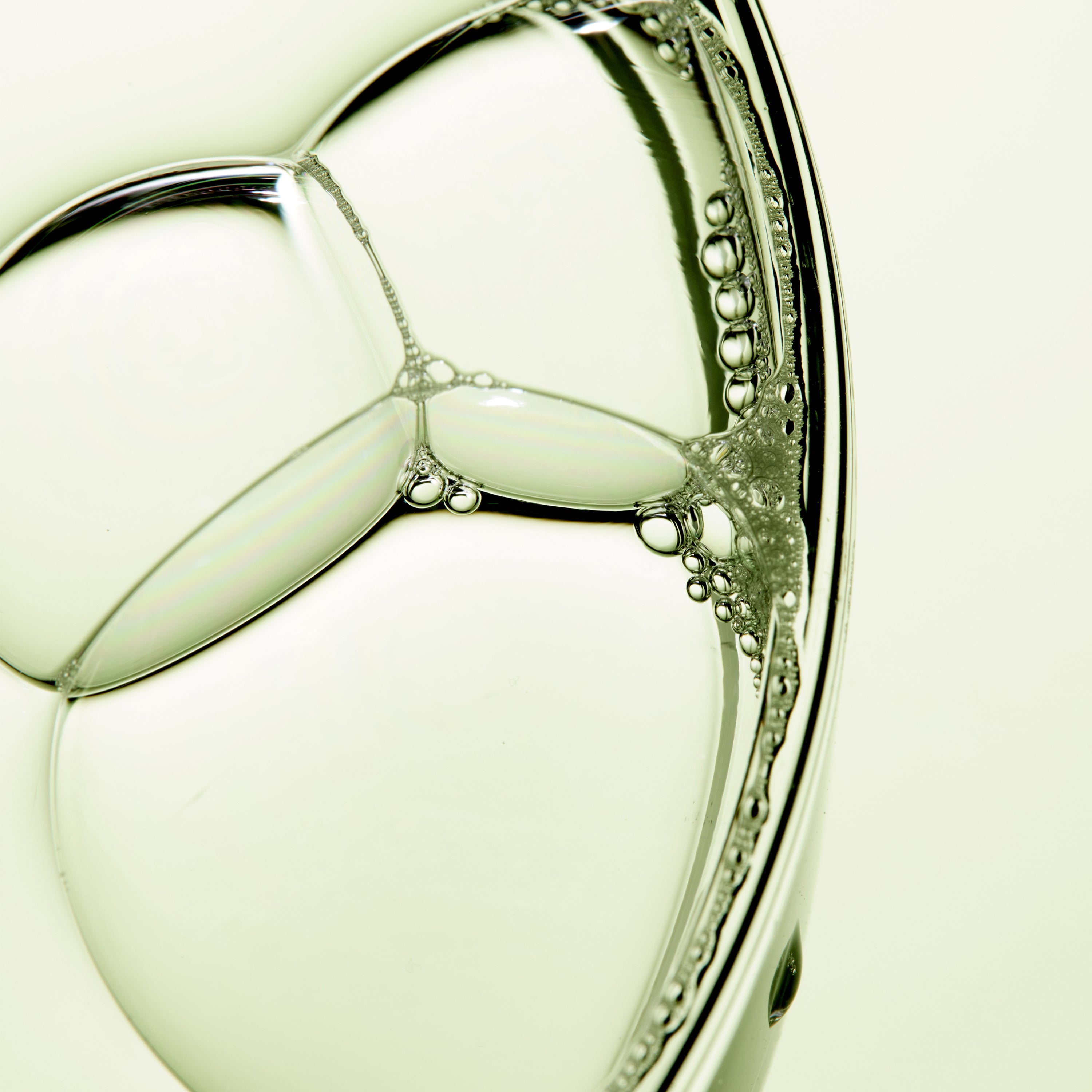 Close-up of a clear, bubbly hydrating gel texture representing the Apple Mint serum